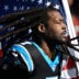 Nov 24, 2024; Charlotte, North Carolina, USA; Carolina Panthers linebacker Jadeveon Clowney (7) runs on to the field with the american flag before the game at Bank of America Stadium.