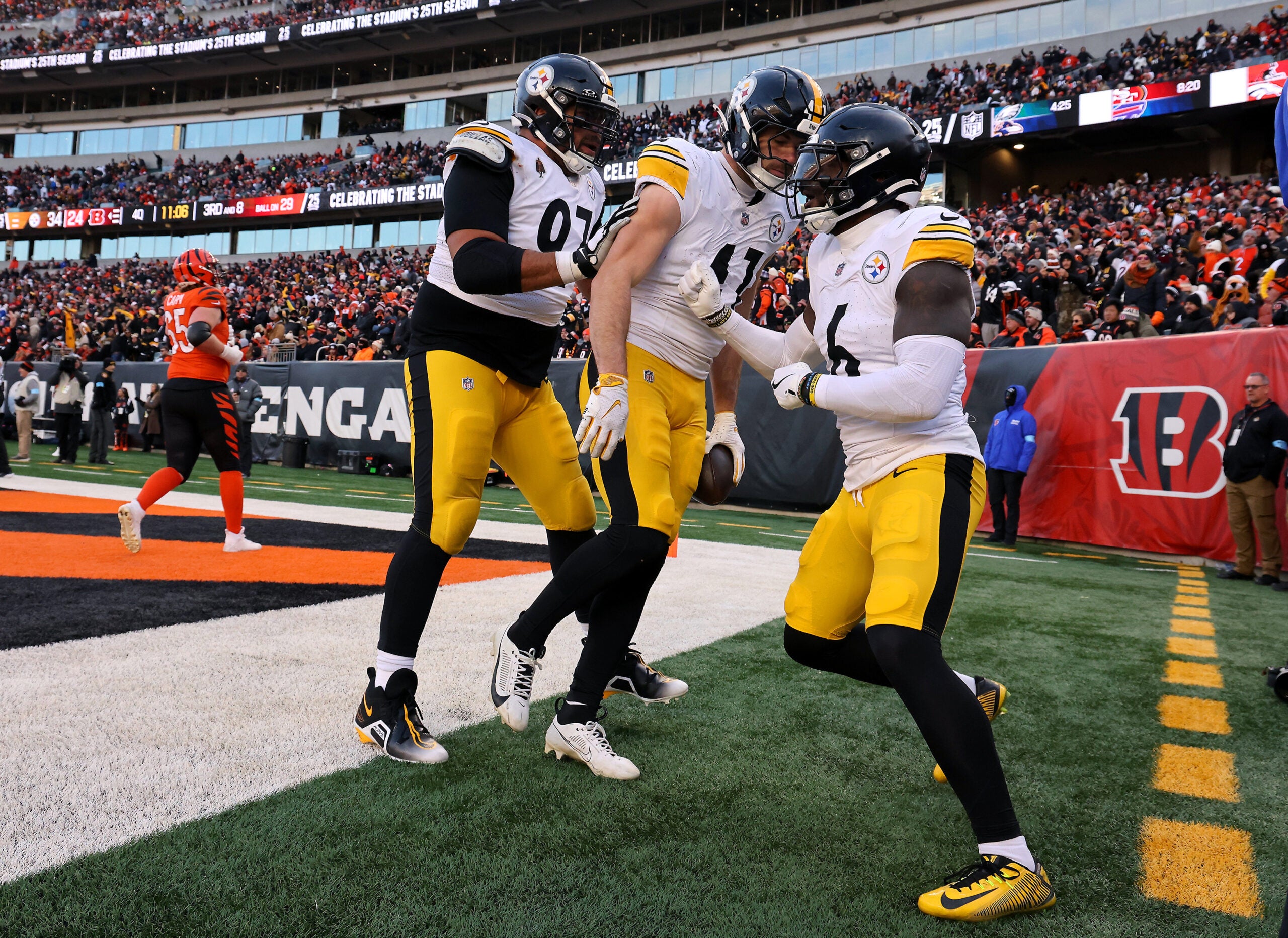 Dec 1, 2024; Cincinnati, Ohio, USA; Pittsburgh Steelers linebacker Payton Wilson (center) celebrates his defensive touchdown with defensive tackle Cameron Heyward (97) and linebacker Patrick Queen (6) during the fourth quarter against the Cincinnati Bengals at Paycor Stadium.