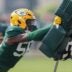 Green Bay Packers linebacker Edgerrin Cooper (56) runs through a drill during practice on Thursday, July 31, 2025, at Ray Nitschke Field in Ashwaubenon, Wis.