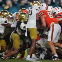 Aug 31, 2025; Miami Gardens, Florida, USA; Miami Hurricanes running back CharMar Brown (6) scores a touchdown against the Notre Dame Fighting Irish during the third quarter at Hard Rock Stadium.