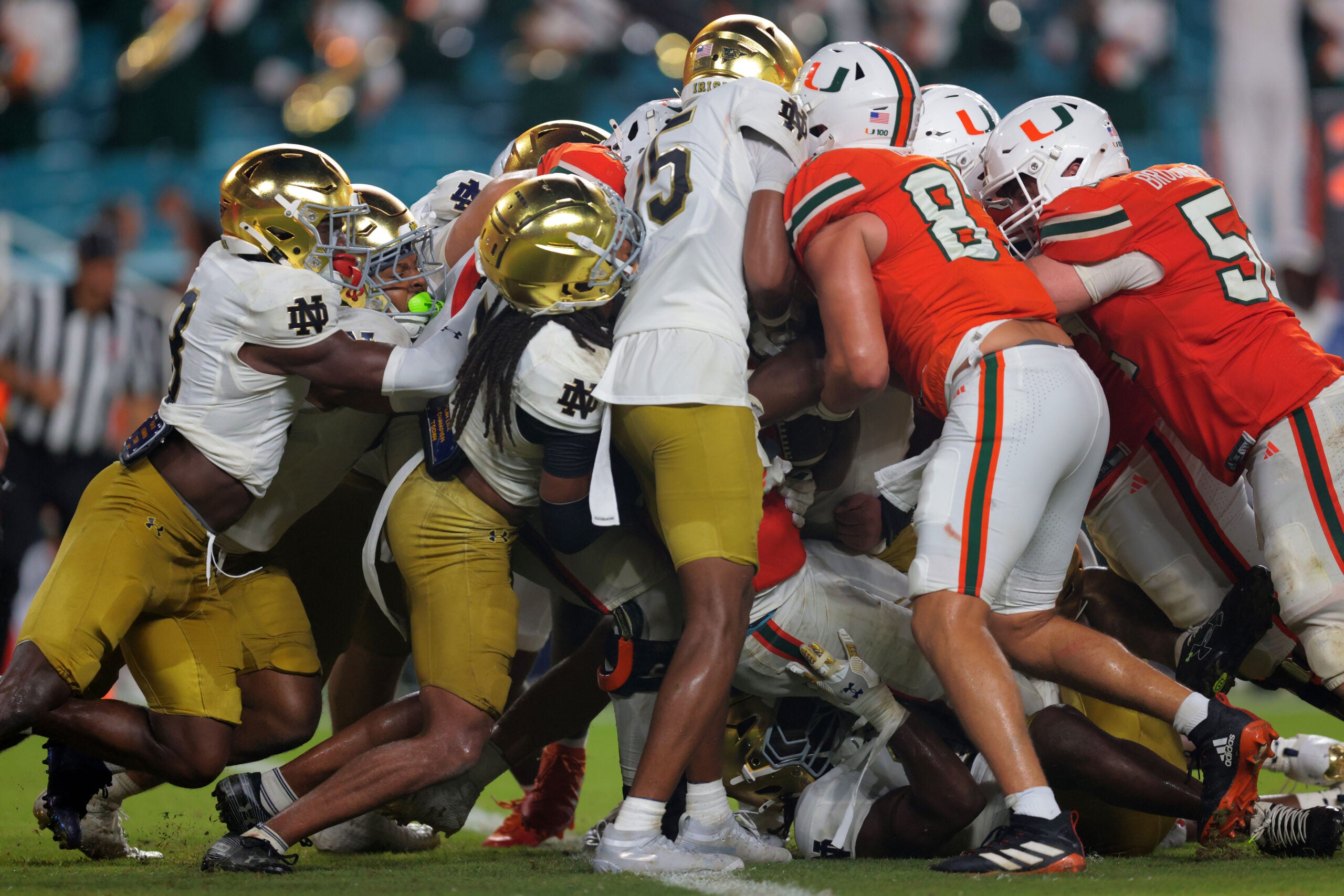 Aug 31, 2025; Miami Gardens, Florida, USA; Miami Hurricanes running back CharMar Brown (6) scores a touchdown against the Notre Dame Fighting Irish during the third quarter at Hard Rock Stadium.