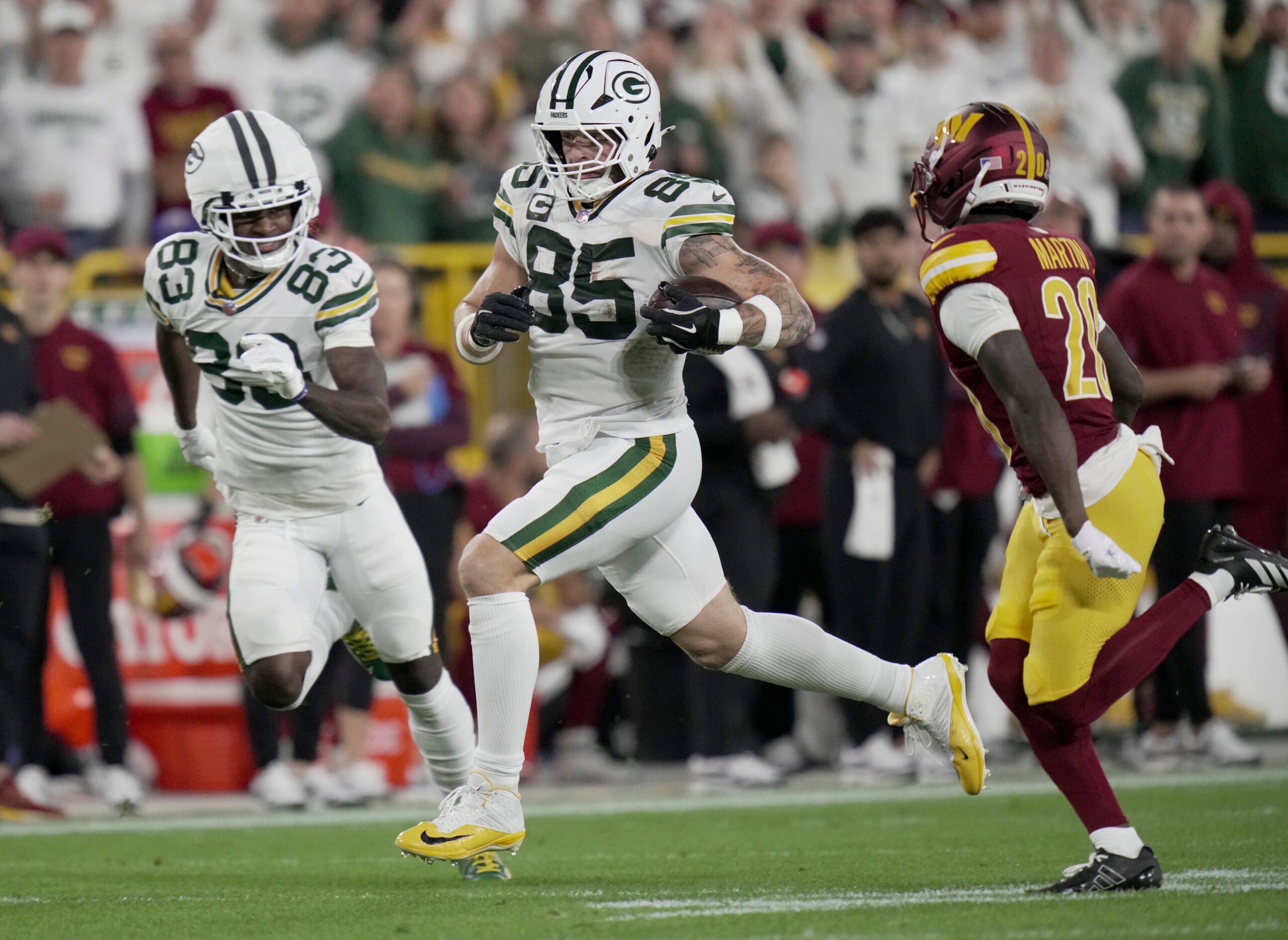 Sep 11, 2025; Green Bay, Wisconsin, USA; Green Bay Packers tight end Tucker Kraft (85) makes a reception during the first quarter against the Washington Commanders at Lambeau Field.