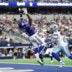 Sep 14, 2025; Arlington, Texas, USA; New York Giants wide receiver Malik Nabers (1) makes a catch for a touchdown against Dallas Cowboys cornerback Trevon Diggs (7) during the second quarter at AT&T Stadium.