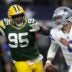 Green Bay Packers defensive tackle Devonte Wyatt (95) rushes Dallas Cowboys quarterback Dak Prescott (4) during the fourth quarter of their wild card playoff game Sunday, January 14, 2024 at AT&T Stadium in Arlington, Texas.