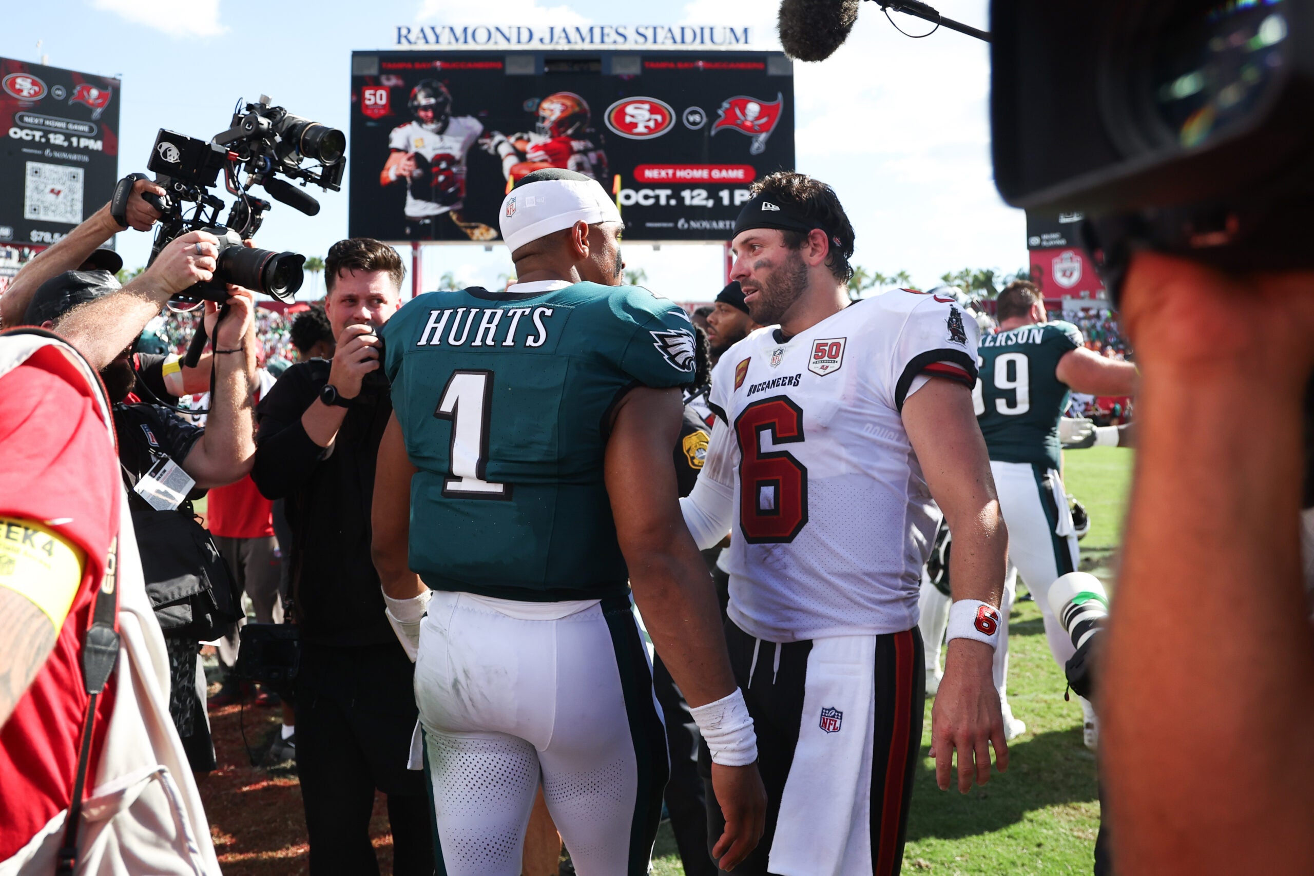 Sep 28, 2025; Tampa, Florida, USA; Philadelphia Eagles quarterback Jalen Hurts (1) and Tampa Bay Buccaneers quarterback Baker Mayfield (6) shake hands after the game at Raymond James Stadium.