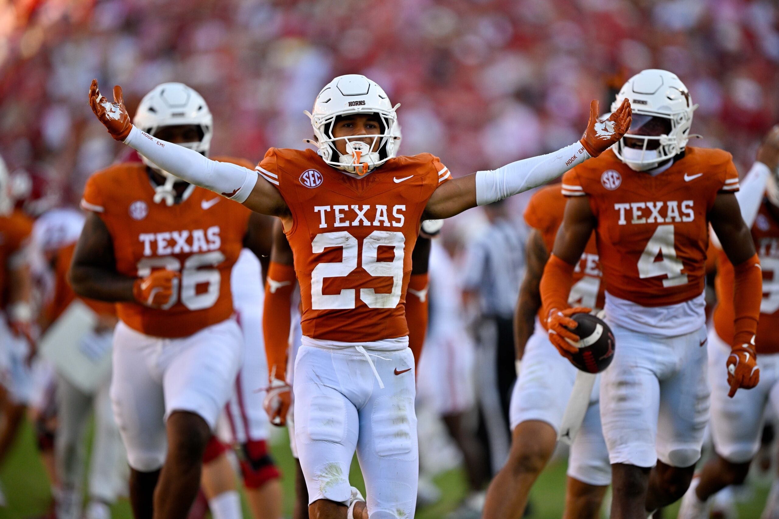 Oct 11, 2025; Dallas, Texas, USA; Texas Longhorns defensive back Graceson Littleton (29) celebrates after he intercepts a pass from Oklahoma Sooners quarterback John Mateer (not pictured) during the second half at the Cotton Bowl.