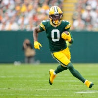 Oct 12, 2025; Green Bay, Wisconsin, USA; Green Bay Packers wide receiver Matthew Golden (0) runs with the ball during the first quarter against the Cincinnati Bengals at Lambeau Field.