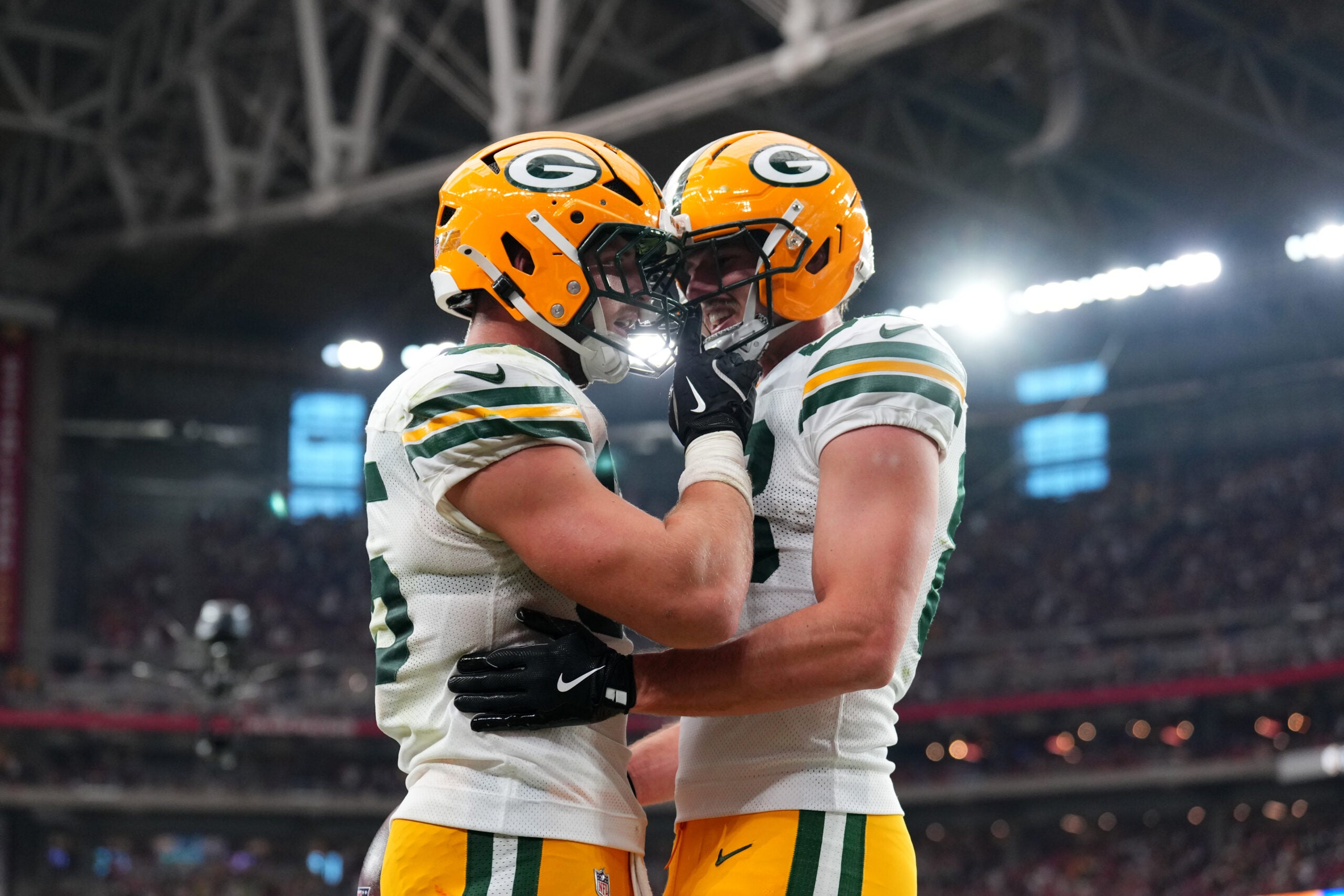 Oct 19, 2025; Glendale, Arizona, USA; Green Bay Packers tight end Tucker Kraft (85) celebrates a touchdown against the Arizona Cardinals with Green Bay Packers tight end Luke Musgrave (88) during the second half against the Arizona Cardinals at State Farm Stadium.