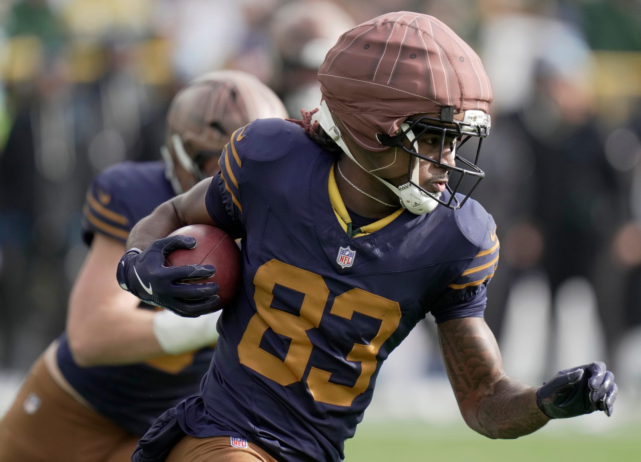 Green Bay Packers wide receiver Savion Williams (83) returns a kickoff 33 yards during the second quarter of their game against the Carolina Panthers Sunday, November 2, 2025 at Lambeau Field in Green Bay, Wisconsin.
