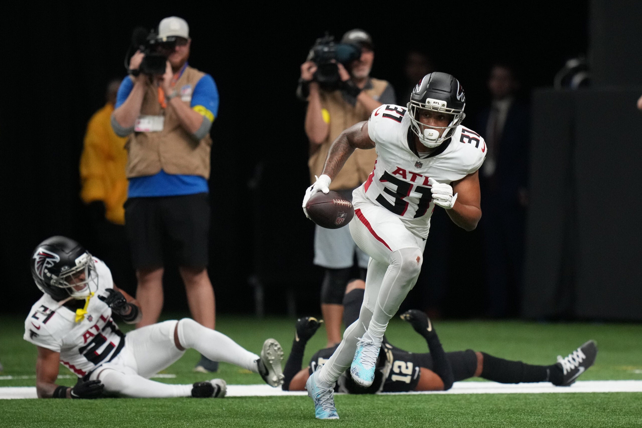 Nov 23, 2025; New Orleans, Louisiana, USA; Atlanta Falcons safety Xavier Watts (31) reacts after making an interception against the New Orleans Saints during the second half at Caesars Superdome.