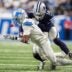 Detroit Lions wide receiver Jameson Williams (1) makes a catch against Dallas Cowboys safety Markquese Bell (14) during the second half at Ford Field in Detroit on Thursday, Dec. 4, 2025.