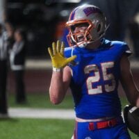 Bolles Bulldogs running back Xander Edwards (25) laughs after scoring his fifth touchdown in the third quarter. Bolles Bulldogs (12-1), hosted Cardinal Gibbons (10-3), in the FHSAA Class 2A high school football semifinal at Bolles School in Jacksonville, Fla. Friday December 5, 2025. The winner advances to the state final in Miami. Bolles won 42-20.