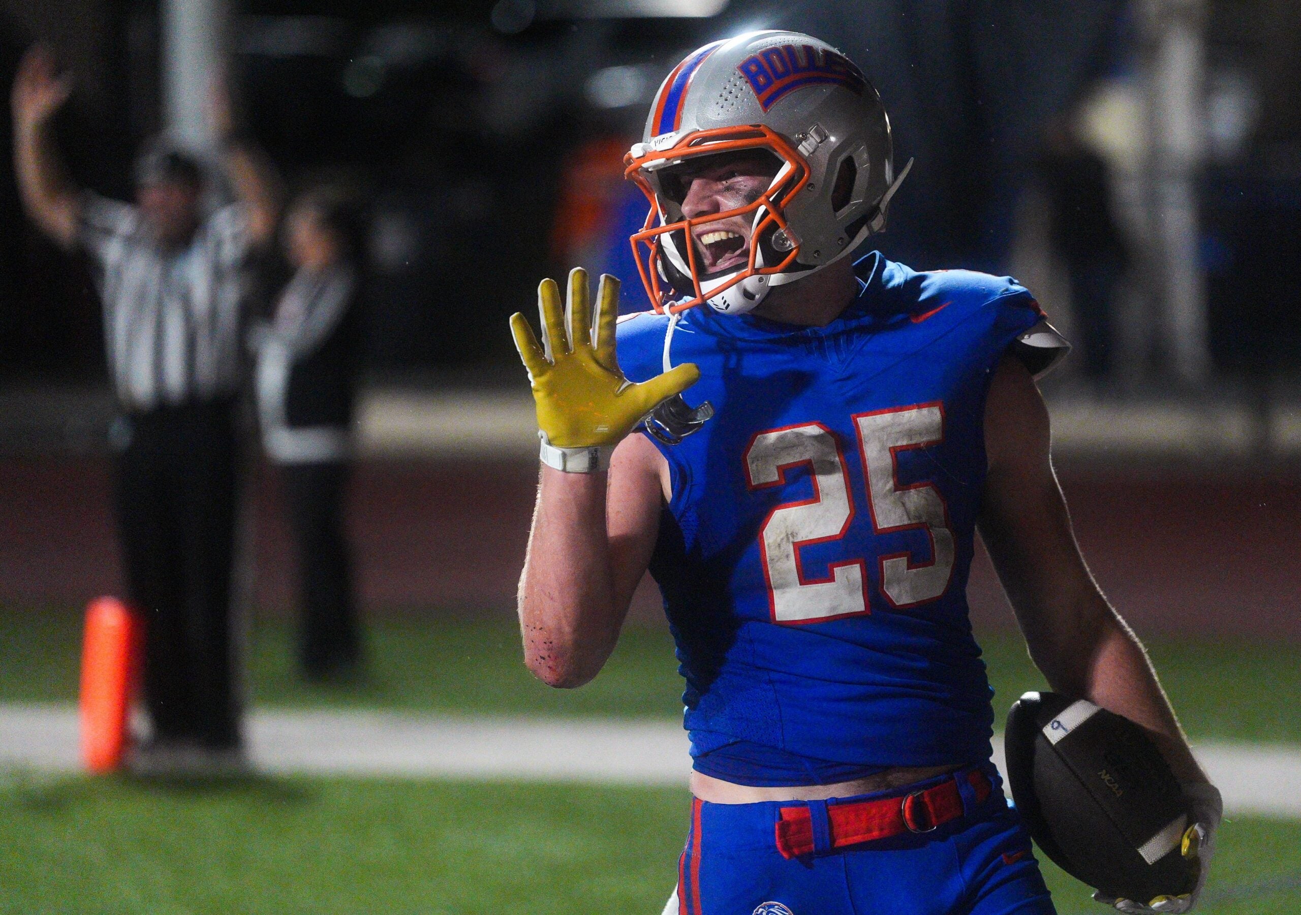 Bolles Bulldogs running back Xander Edwards (25) laughs after scoring his fifth touchdown in the third quarter. Bolles Bulldogs (12-1), hosted Cardinal Gibbons (10-3), in the FHSAA Class 2A high school football semifinal at Bolles School in Jacksonville, Fla. Friday December 5, 2025. The winner advances to the state final in Miami. Bolles won 42-20.