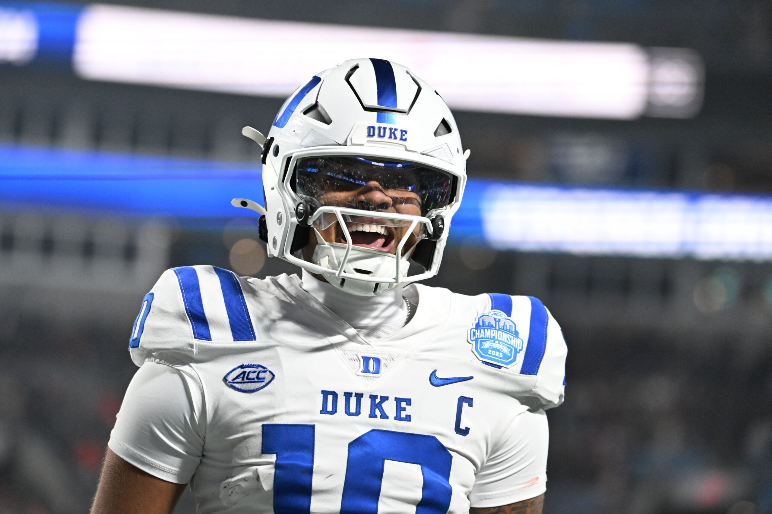 Dec 6, 2025; Charlotte, NC, USA; Duke Blue Devils quarterback Darian Mensah (10) celebrates after the Blue Devils score a touchdown in overtime during the ACC Championship game at Bank of America Stadium.
