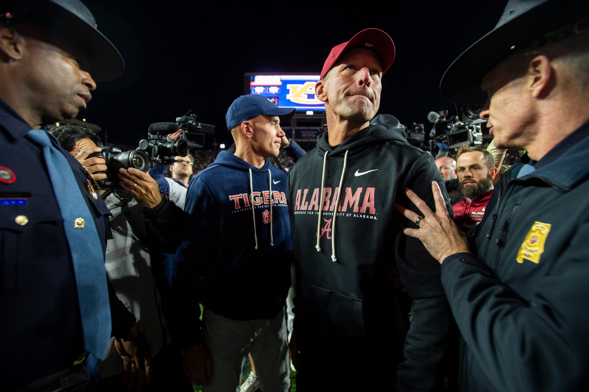Auburn Tigers interim head coach DJ Durkin and Alabama Crimson Tide head coach Kalen DeBoer shake hands after the game as Auburn Tigers take on Alabama Crimson Tide in the Iron Bowl at Jordan-Hare Stadium in Auburn, Ala. on Saturday, Nov. 29, 2025. Alabama Crimson Tide defeated Auburn Tigers 27-20.