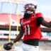 Dec 19, 2025; Tampa, FL, USA; NC State Wolfpack quarterback CJ Bailey (11) runs into the end zone for a touchdown against the Memphis Tigers in the first quarter during the Gasparilla Bowl at Raymond James Stadium.