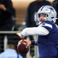Dec 21, 2025; Arlington, Texas, USA; Dallas Cowboys quarterback Dak Prescott (4) participates in pregame warmups against the Los Angeles Chargers at AT&T Stadium.