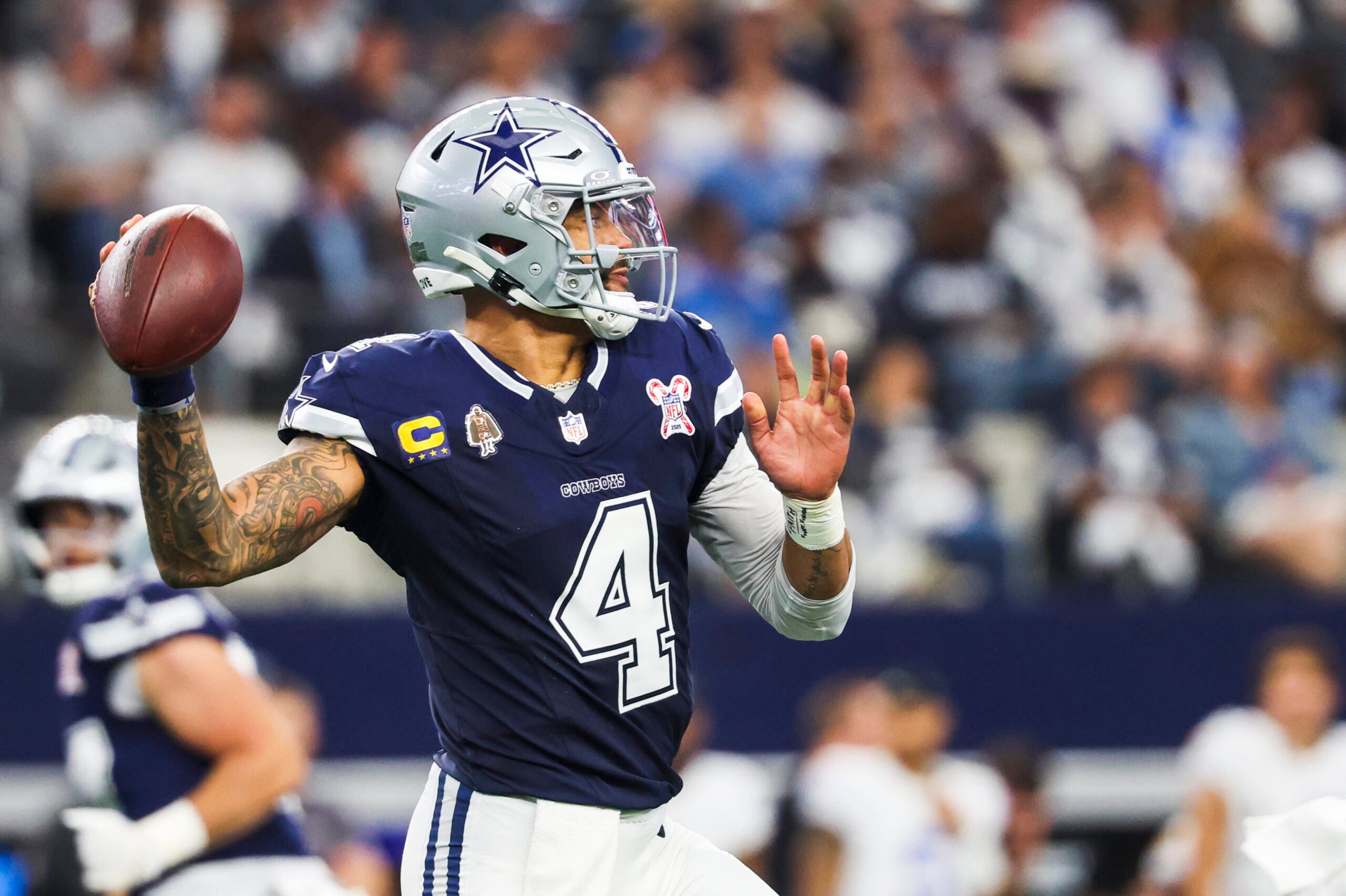 Dec 21, 2025; Arlington, Texas, USA; Dallas Cowboys quarterback Dak Prescott (4) passes against the Los Angeles Chargers during the first quarter at AT&T Stadium.