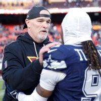 Dec 25, 2025; Landover, Maryland, USA; Washington Commanders head coach Dan Quinn speaks to Dallas Cowboys wide receiver Kavontae Turpin (9) after the game at Northwest Stadium.