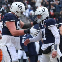 Dec 27, 2025; Bronx, NY, USA; Penn State Nittany Lions quarterback Ethan Grunkemeyer (17) celebrates with offensive lineman Cooper Cousins (50) after a touchdown pass during the second half of the 2025 Pinstripe Bowl against the Clemson Tigers at Yankee Stadium.