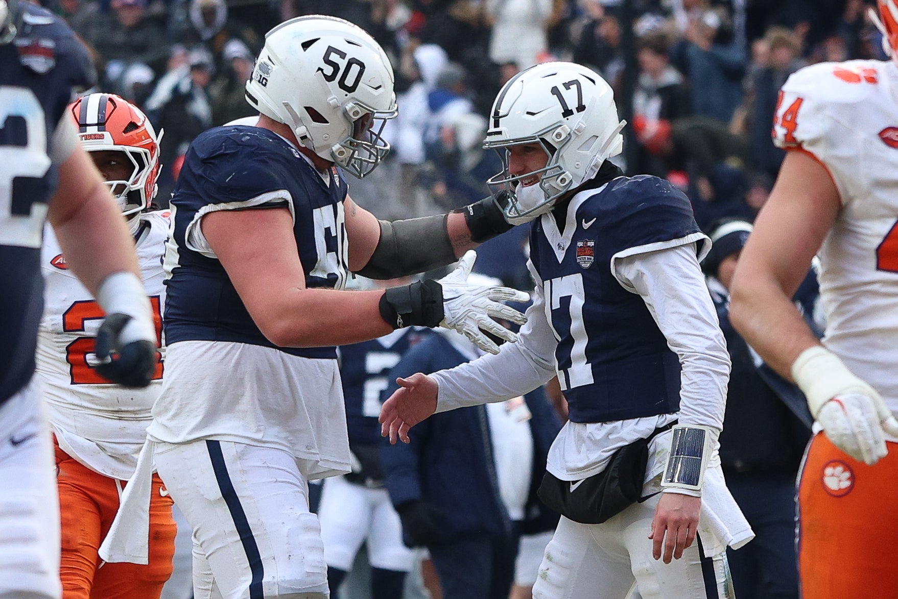 Dec 27, 2025; Bronx, NY, USA; Penn State Nittany Lions quarterback Ethan Grunkemeyer (17) celebrates with offensive lineman Cooper Cousins (50) after a touchdown pass during the second half of the 2025 Pinstripe Bowl against the Clemson Tigers at Yankee Stadium.