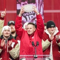 Indiana Hoosiers head coach Curt Cignetti holds up the coaches trophy on Saturday, Jan. 24, 2026, during the Indiana Football College Football Playoff National Championship celebration and parade at Memorial Stadium in Bloomington.