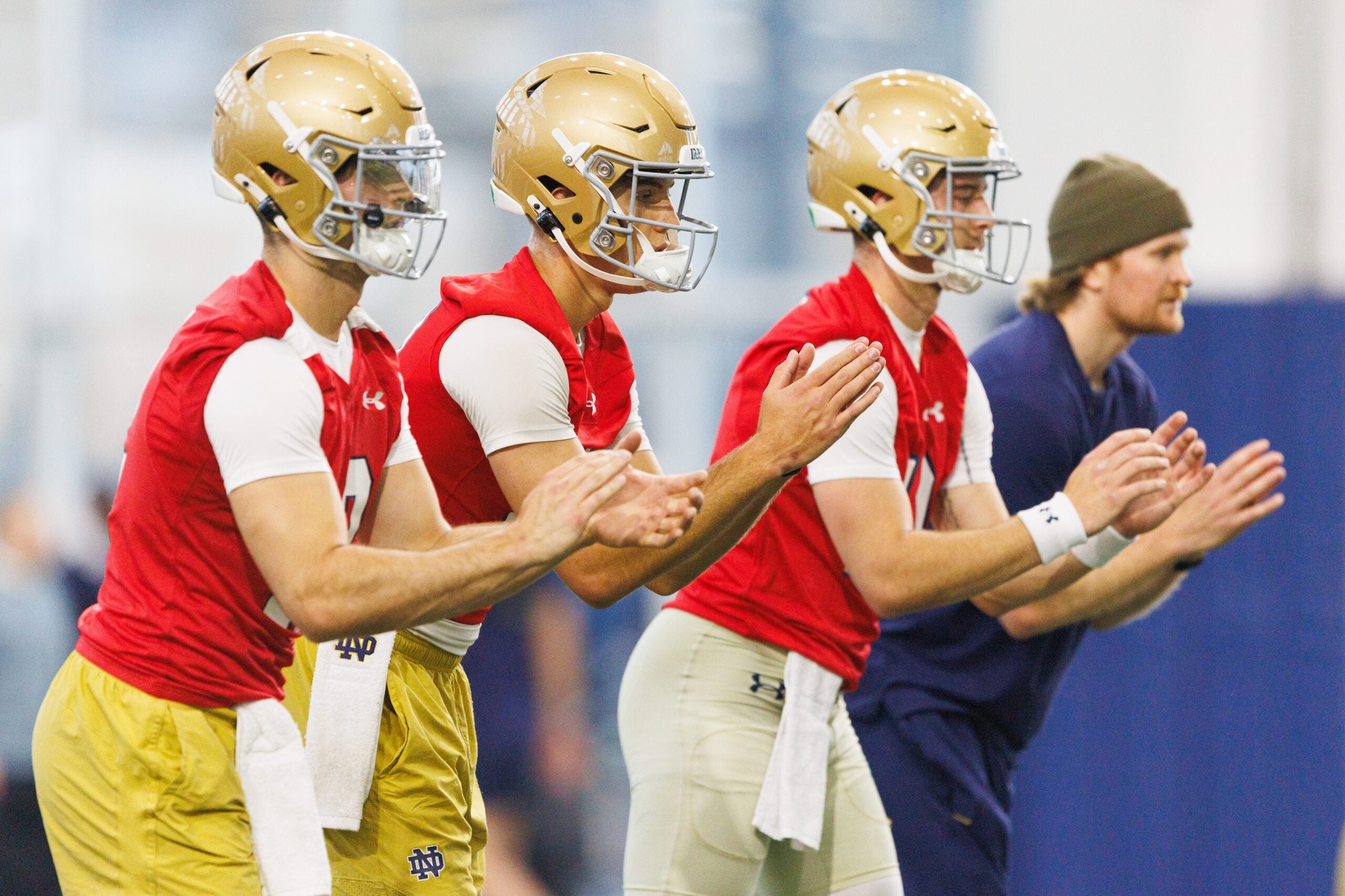 Notre Dame quarterbacks Blake Hebert, left, Noah Grubbs, center, and CJ Carr wait for a snap during a football practice at Irish Athletic Center on Friday, March 20, 2026, in South Bend.