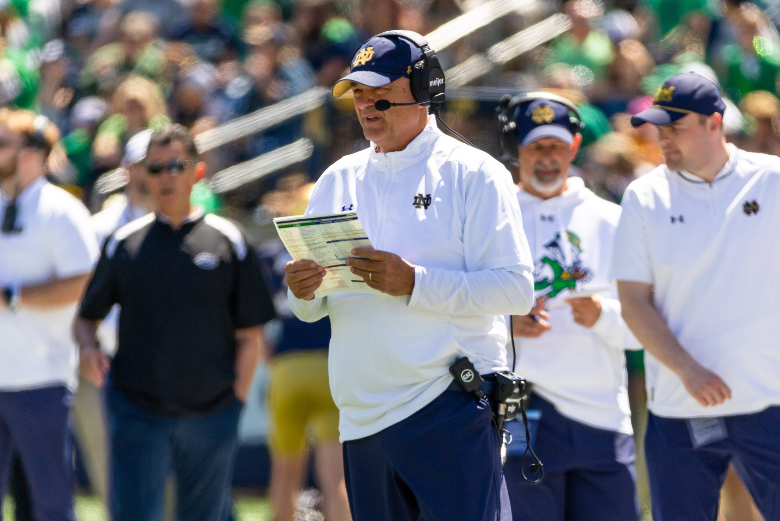Apr 25, 2026; Notre Dame, IN, USA; Notre Dame offensive coordinator Mike Denbrock calls plays during the Blue-Gold game at Notre Dame Stadium.