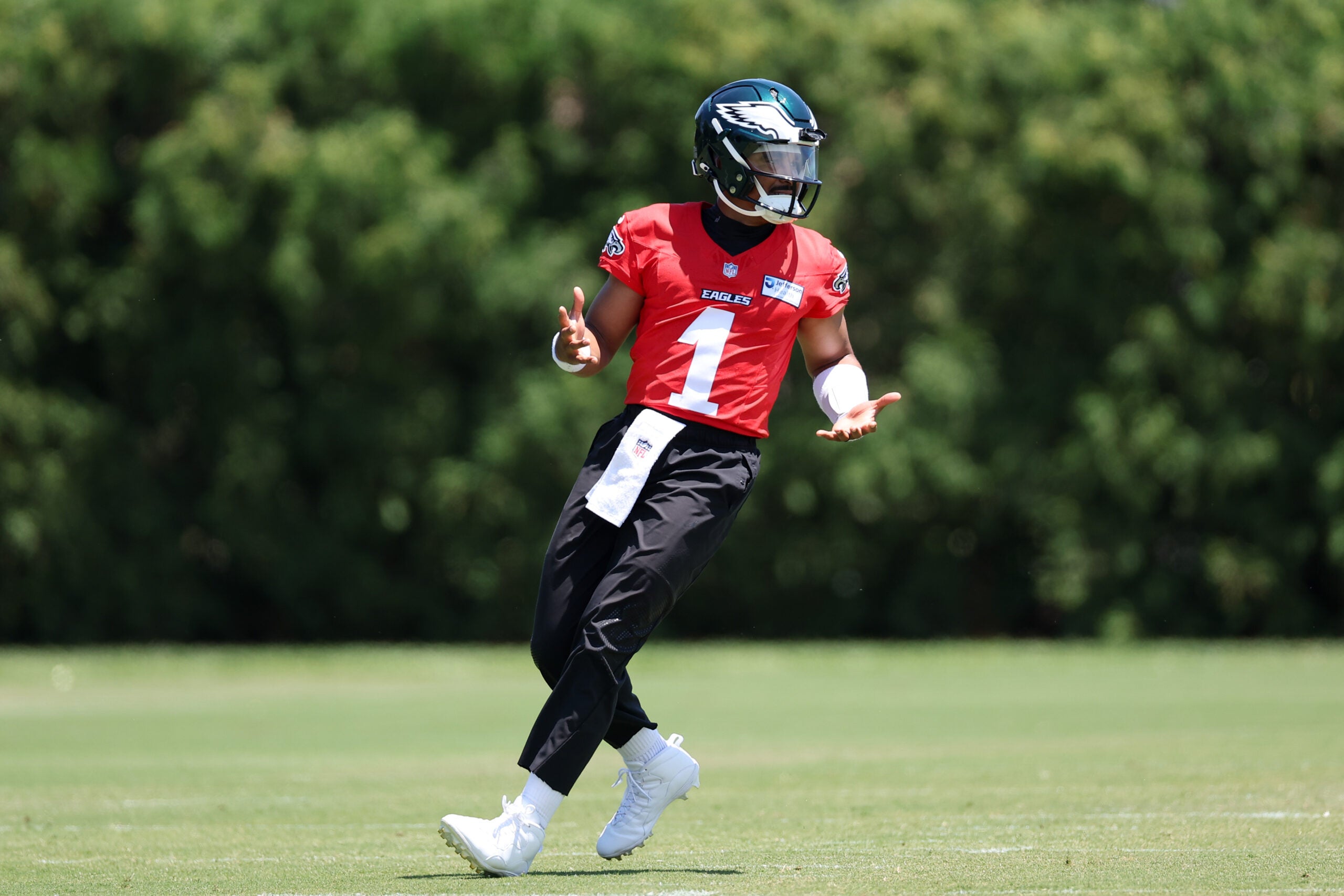 Jun 9, 2026; Philadelphia, PA, USA; Philadelphia Eagles quarterback Jalen Hurts (1) reacts to a drill during minicamp at Jefferson Health Training Complex.