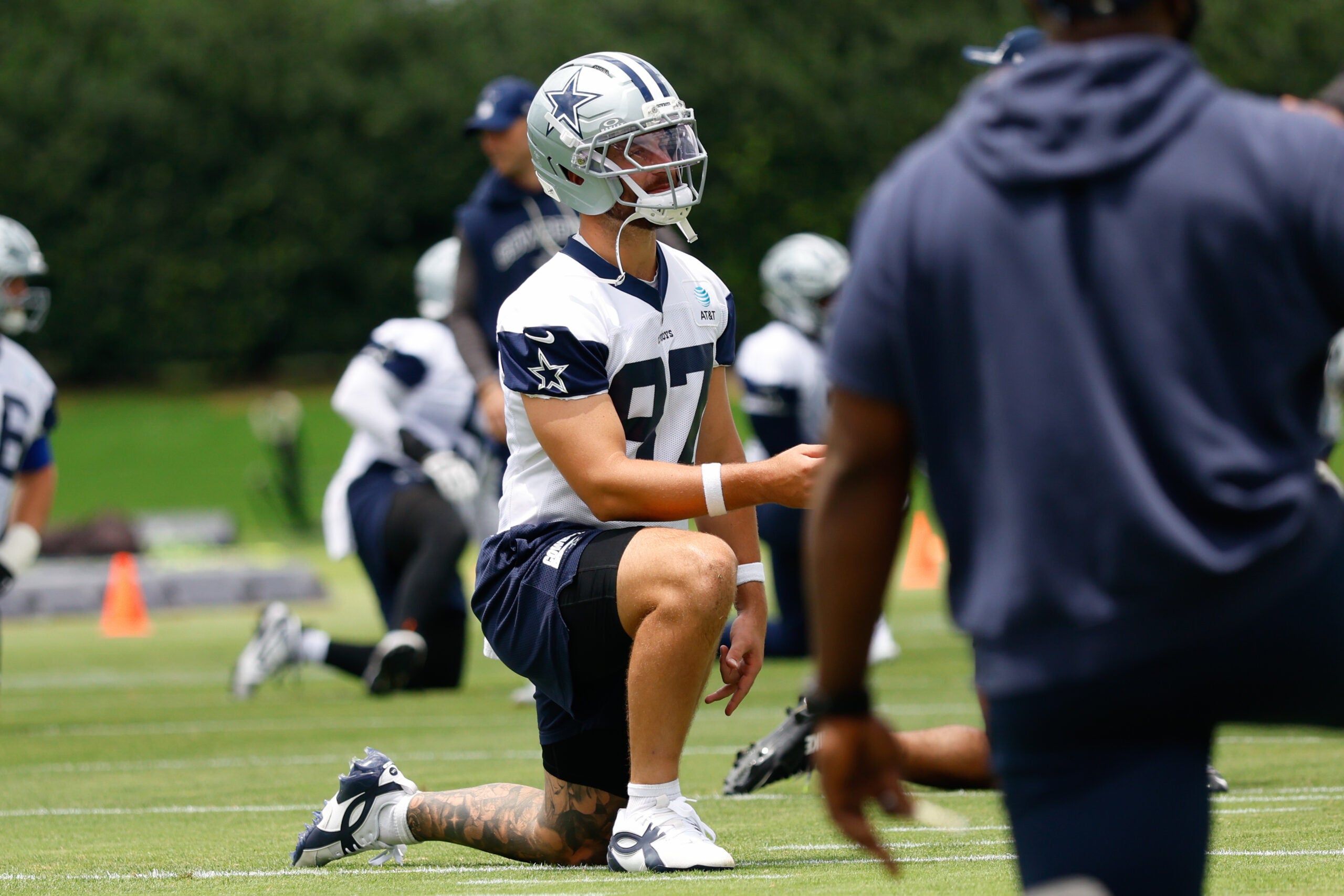 Jun 16, 2026; Dallas, TX, USA; Dallas Cowboys tight end Jake Ferguson (87) stretches before practice at the Ford Center at the Star Training Facility in Frisco, Texas.