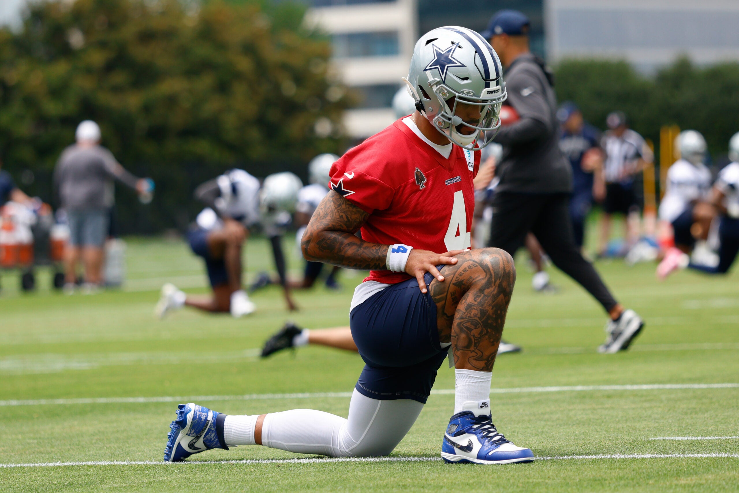 Jun 16, 2026; Dallas, TX, USA; Dallas Cowboys quarterback Dak Prescott (4) stretches before practice at the Ford Center at the Star Training Facility in Frisco, Texas.