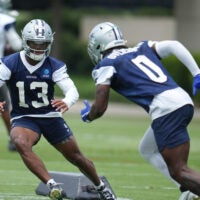 Jun 16, 2026; Dallas, TX, USA; Dallas Cowboys safety Caleb Downs (13) and linebacker DeMarvion Overshown (0) go through a drill during practice at the Ford Center at the Star Training Facility in Frisco, Texas.