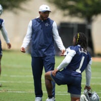 Jun 16, 2026; Dallas, TX, USA; Dallas Cowboys defensive coordinator Christian Parker speaks with wide receiver PJ Locke (1) during practice at the Ford Center at the Star Training Facility in Frisco, Texas.