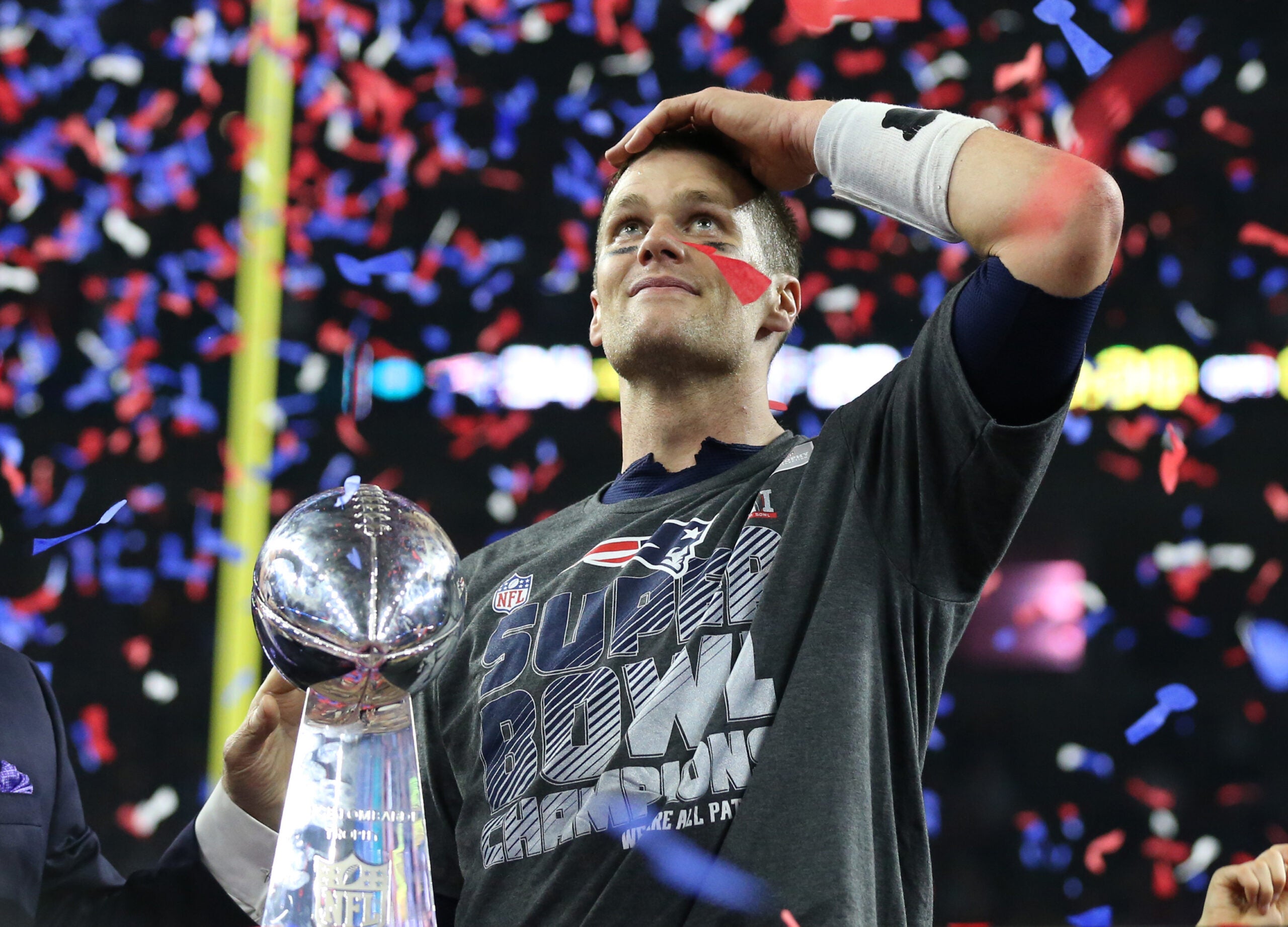 Feb 5, 2017; Houston, TX, USA; New England Patriots quarterback Tom Brady (12) celebrates with the Vince Lombardi Trophy after beating the Atlanta Falcons during Super Bowl LI at NRG Stadium.