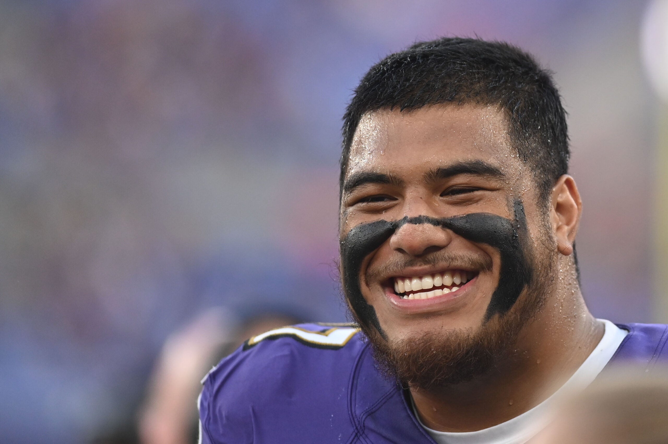 Aug 11, 2022; Baltimore, Maryland, USA; Baltimore Ravens offensive tackle Daniel Faalele (77) smiles during the first half against the Tennessee Titans at M&T Bank Stadium.