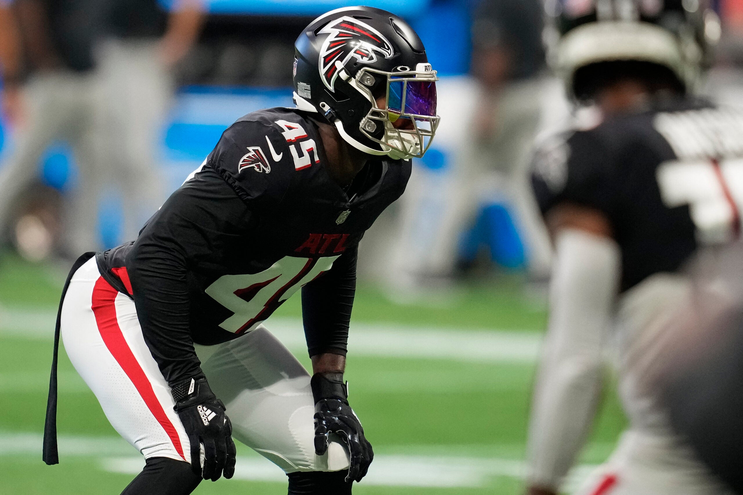 Aug 27, 2022; Atlanta, Georgia, USA; Atlanta Falcons linebacker Deion Jones (45) on the field prior to the game against the Jacksonville Jaguars at Mercedes-Benz Stadium.