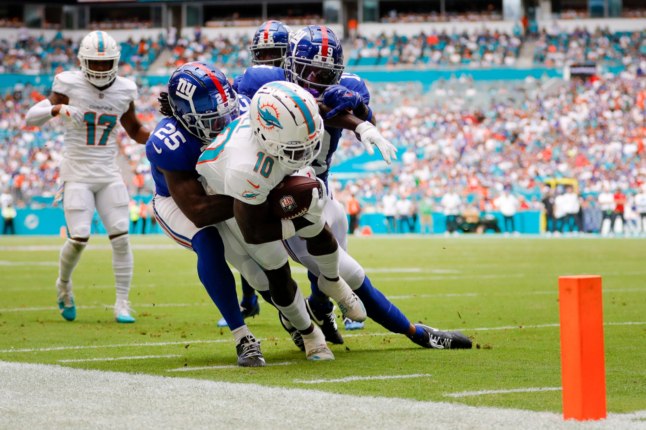 Oct 8, 2023; Miami Gardens, Florida, USA; Miami Dolphins wide receiver Tyreek Hill (10) runs with the football against the New York Giants during the first quarter at Hard Rock Stadium.