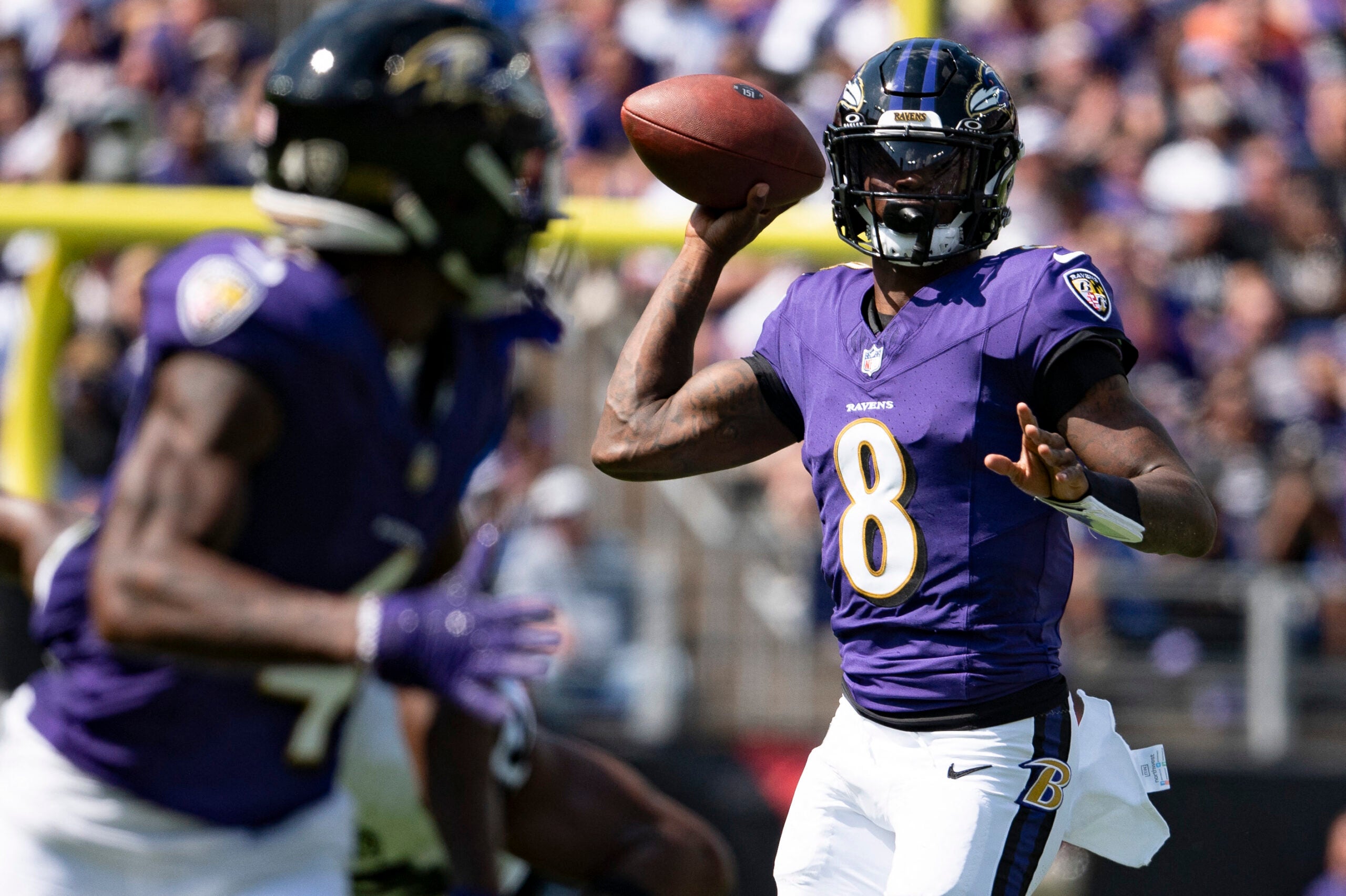 Sep 15, 2024; Baltimore, Maryland, USA; Baltimore Ravens quarterback Lamar Jackson (8) throws looks to throw wide receiver Zay Flowers (4) during the first half against the Las Vegas Raiders at M&T Bank Stadium.