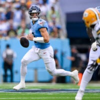 Sep 22, 2024; Nashville, Tennessee, USA; Tennessee Titans Will Levis (8) scrambles against the Green Bay Packers during the first half at Nissan Stadium.