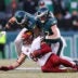 Jan 26, 2025; Philadelphia, PA, USA; Philadelphia Eagles linebacker Zack Baun (53) and safety Reed Blankenship (32) tackle Washington Commanders tight end Zach Ertz (86) during the first half in the NFC Championship game at Lincoln Financial Field.