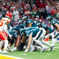 Feb 9, 2025; New Orleans, LA, USA; Philadelphia Eagles quarterback Jalen Hurts (1) lines up for the tush push play on the goal line against the Kansas City Chiefs during Super Bowl LIX at Ceasars Superdome.
