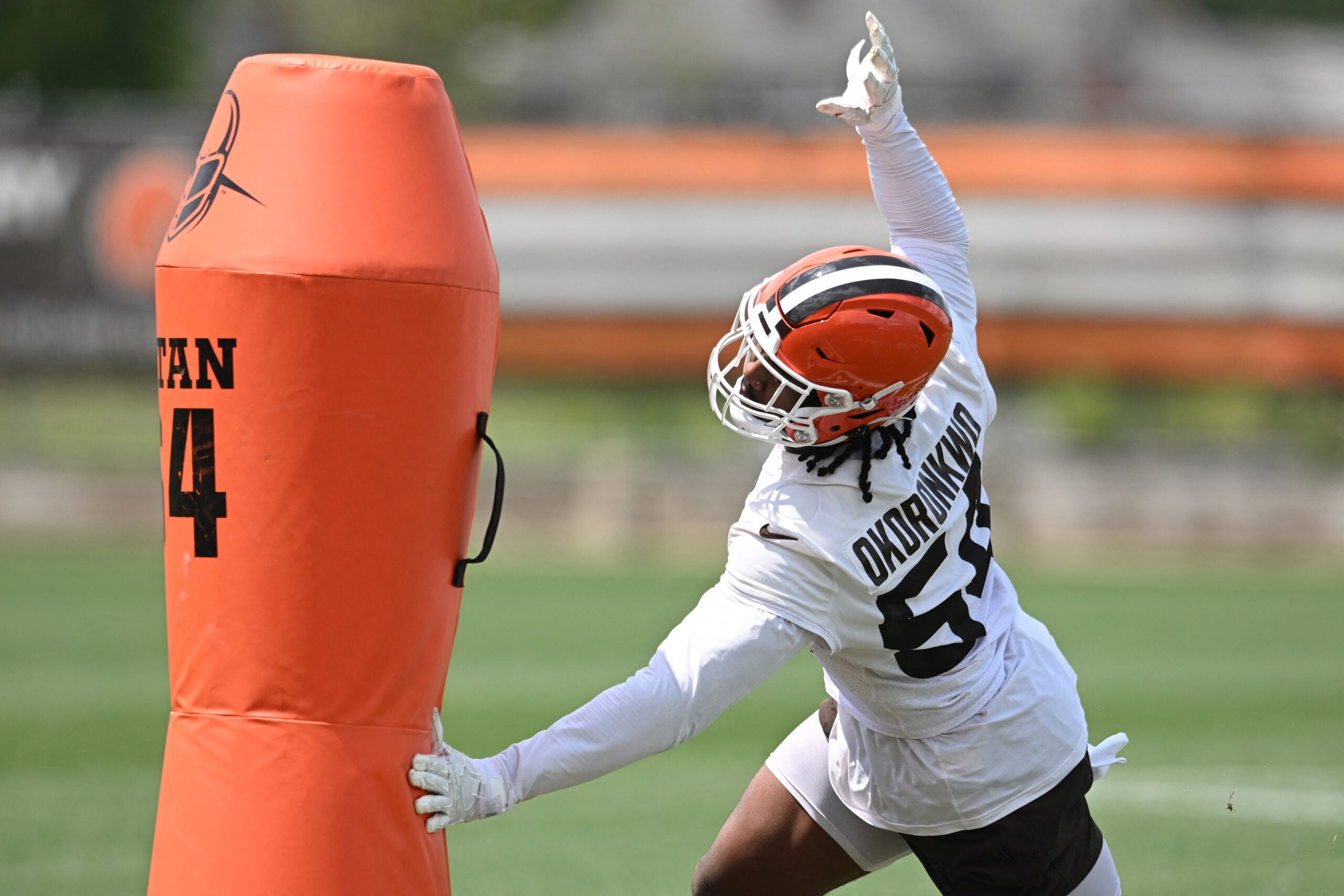 Jun 10, 2025; Berea, OH, USA; Cleveland Browns defensive end Ogbo Okoronkwo (54) runs a drill during minicamp at CrossCountry Mortgage Campus.