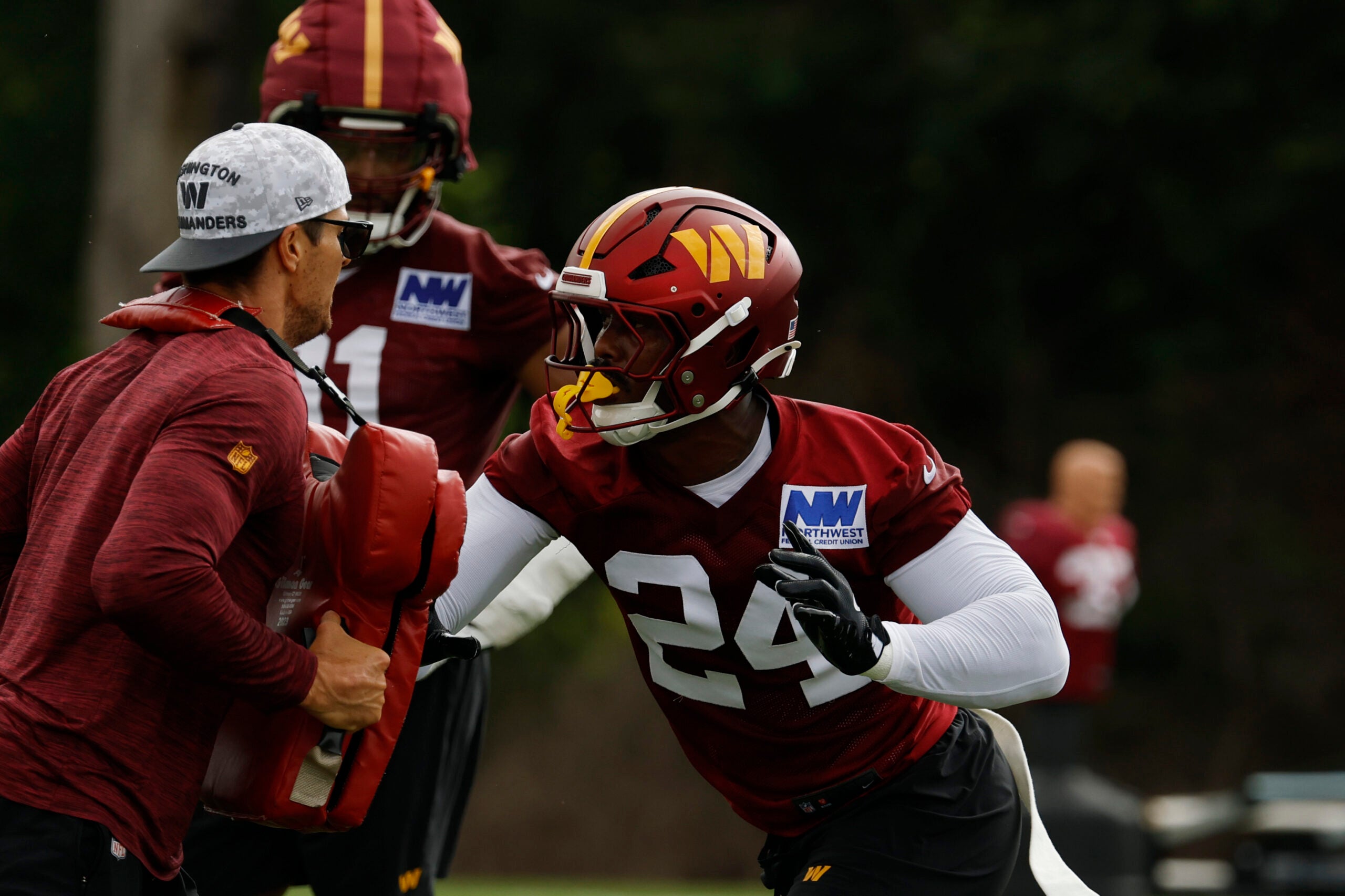 Jul 23, 2025; Ashburn, VA, USA; Washington Commanders outside linebacker Von Miller (24) participates in a drill with Commanders pass rush specialist/assistant linebackers coach Ryan Kerrigan during practice on day one of training camp at OrthoVirginia Training Center at Commanders Park.