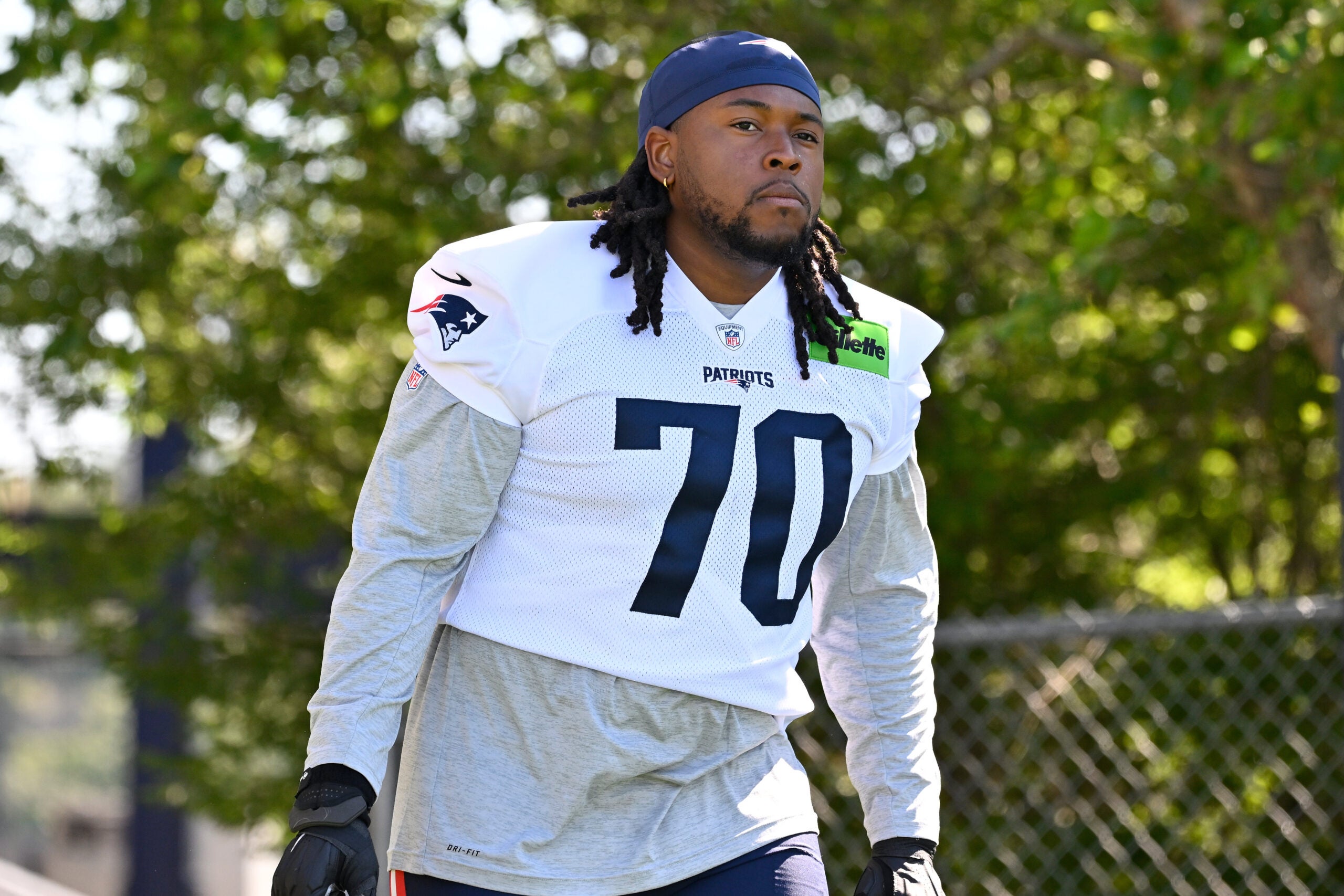 Jul 23, 2025; Foxborough, MA, USA; New England Patriots offensive tackle Caedan Wallace (70) walks to the practice field for training camp at Gillette Stadium.