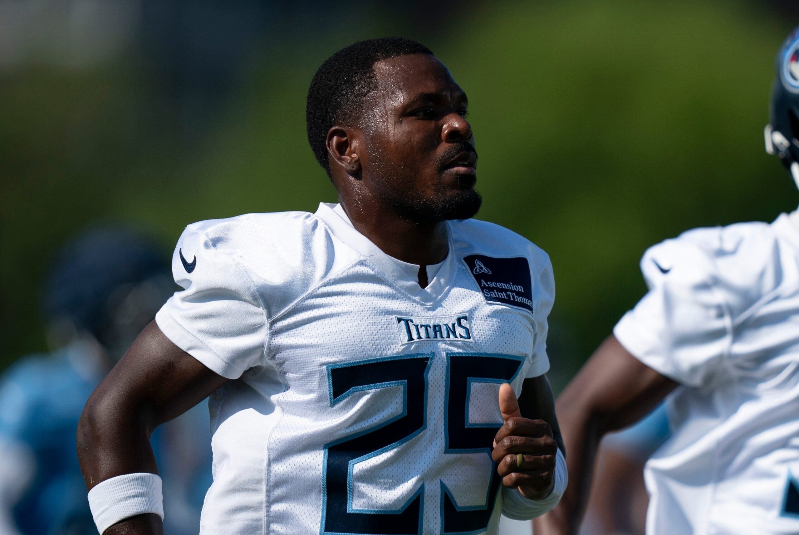 Tennessee Titans safety Xavier Woods (25) runs through drills during the Tennessee Titans second day of training camp at Ascension Saint Thomas Sports Park in Nashville, Tenn., Thursday, July 24, 2025.