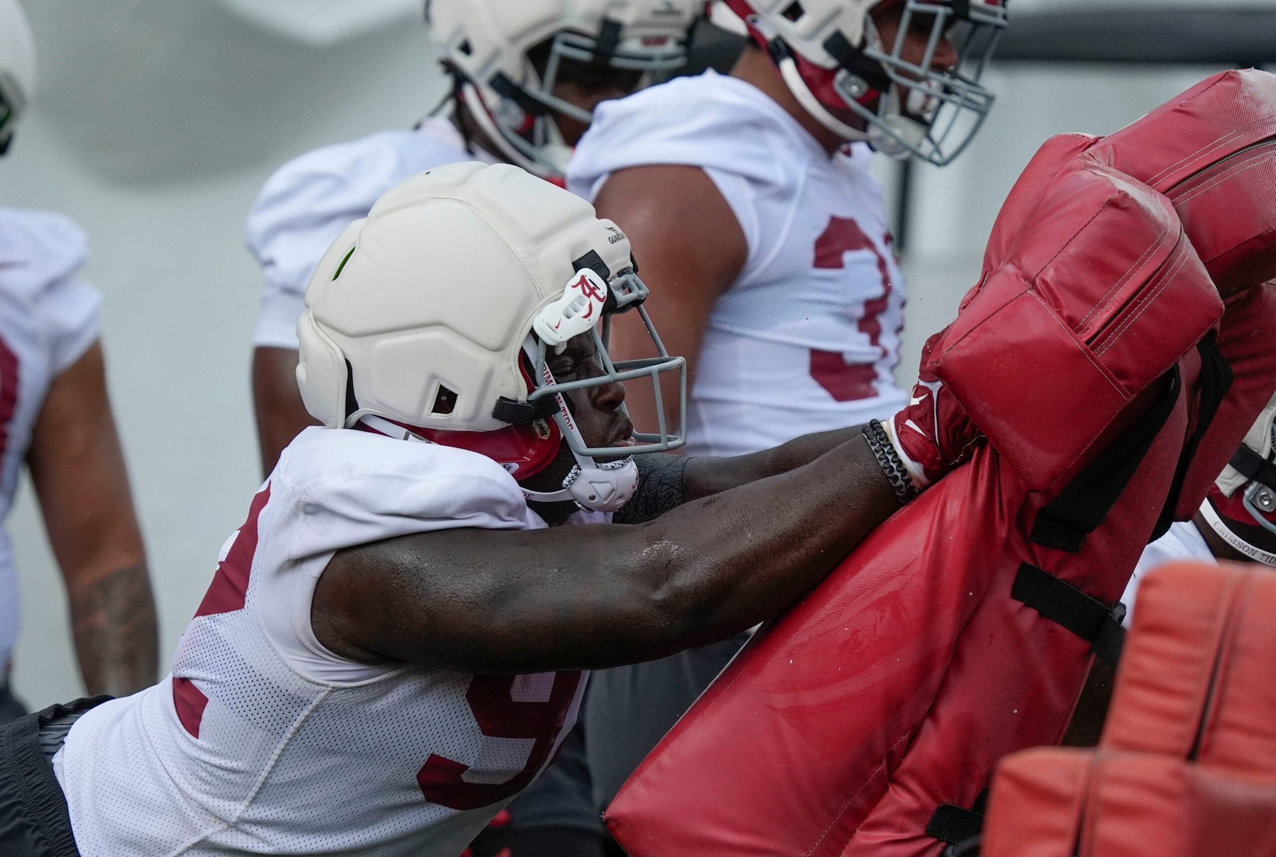 uly 30, 2025; Tuscaloosa, AL, USA; defensive lineman Jeremiah Beaman hits the sled during the first practice session of the preseason for the Alabama Crimson Tide.