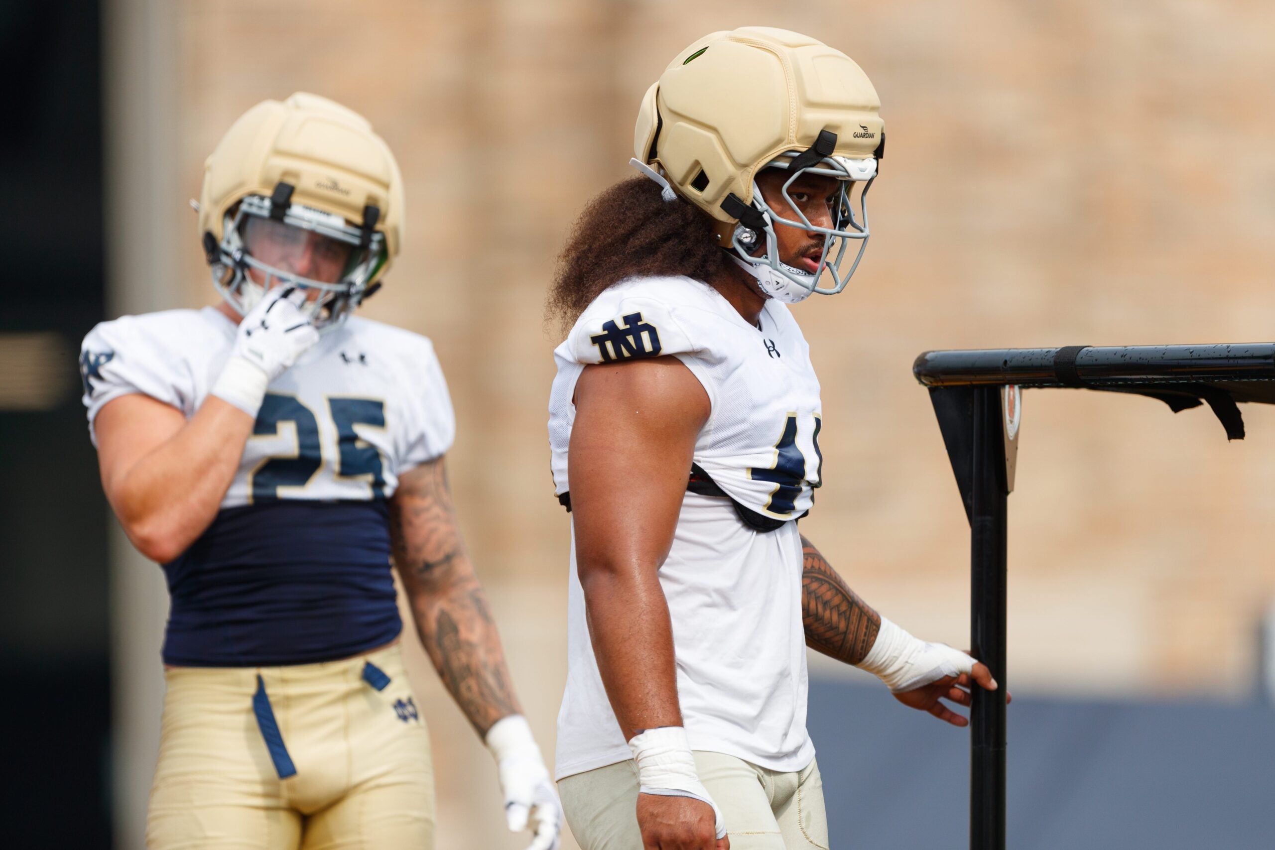 Notre Dame defensive lineman Junior Tuihalamaka, right, lines up for a drill during a football practice at Irish Athletic Center on Thursday, July 31, 2025, in South Bend.
