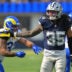 Aug 9, 2025; Inglewood, California, USA; Dallas Cowboys linebacker Marist Liufau (35) grabs a hold of Los Angeles Rams running back Cody Schrader (32) following a play inthe first half at SoFi Stadium.