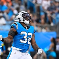 Aug 8, 2025; Charlotte, North Carolina, USA; Carolina Panthers linebacker Trevin Wallace (32) reacts in the first quarter at Bank of America Stadium.
