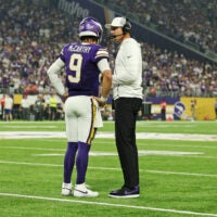 Sep 14, 2025; Minneapolis, Minnesota, USA; Minnesota Vikings quarterback J.J. McCarthy (9) speaks with Minnesota Vikings head coach Kevin O'Connell during the first half against the Atlanta Falcons at U.S. Bank Stadium.